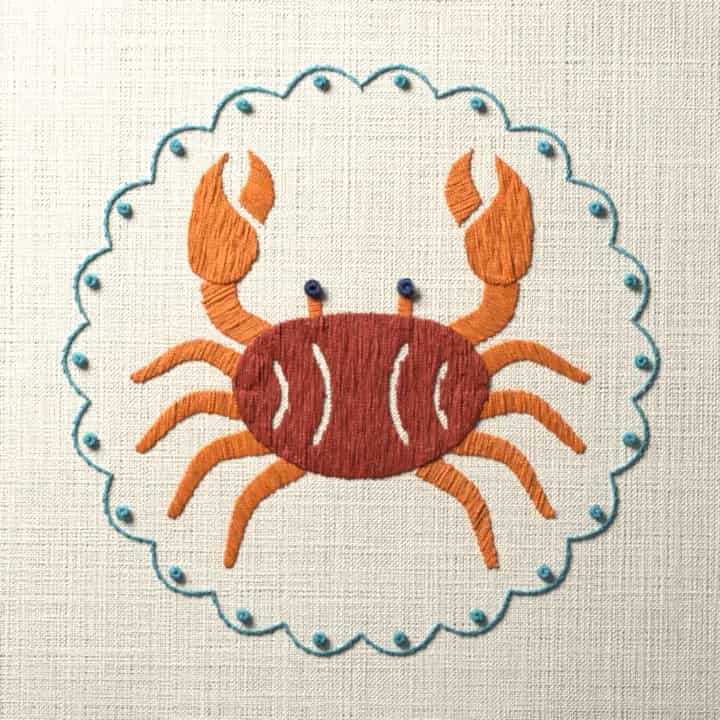 Crab in a scalloped ring: preview of the stitched design