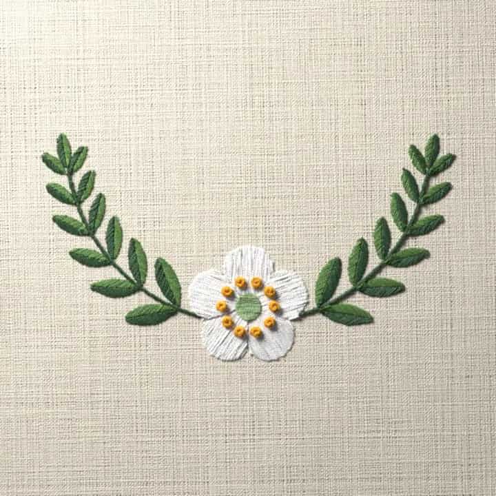 Christmas rose crescent spray: preview of the stitched design