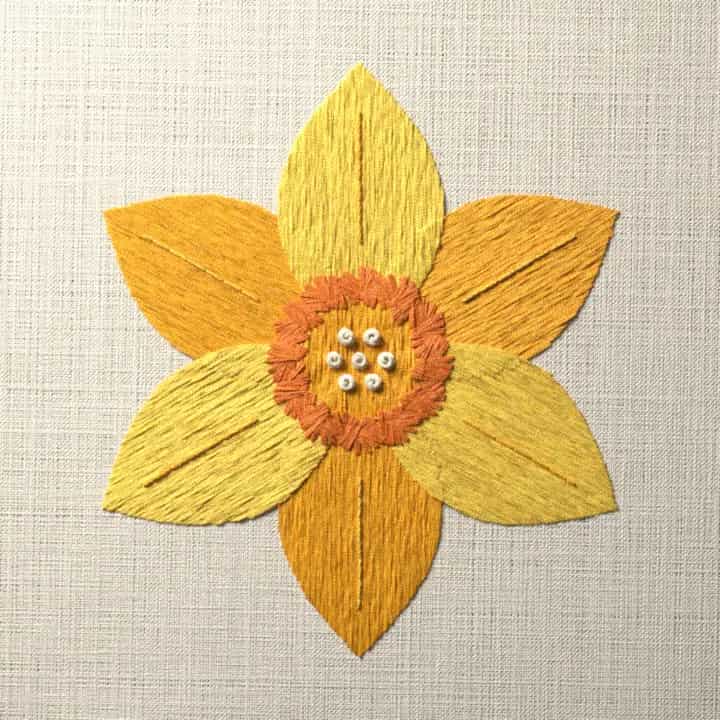 Yellow and gold daffodil bloom: preview of the stitched design