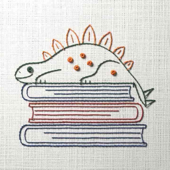 Dinosaur on a stack of books: preview of the stitched design