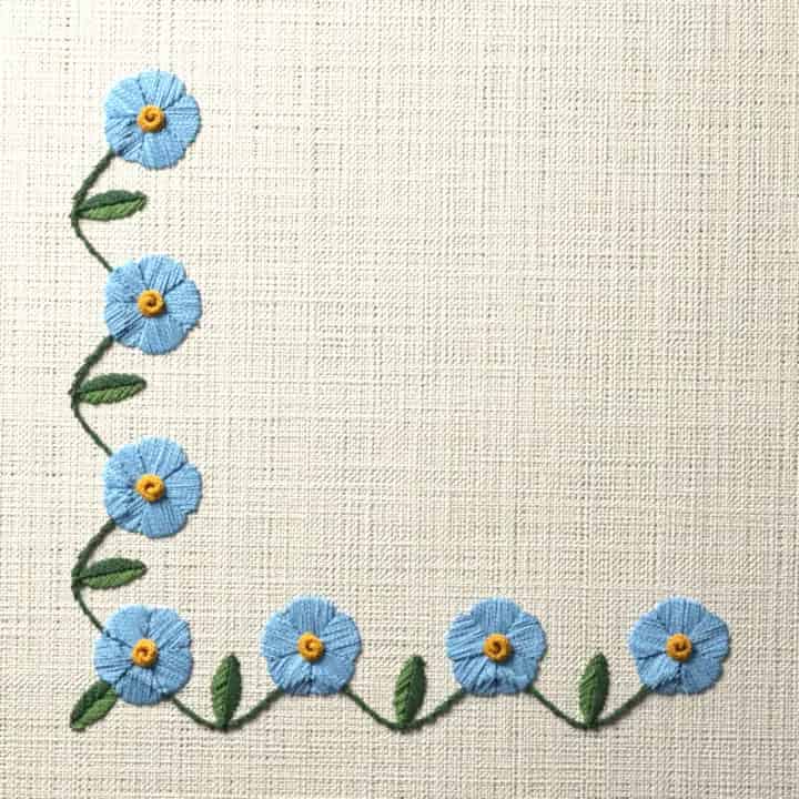 Forget-me-not vine corner: preview of the stitched design