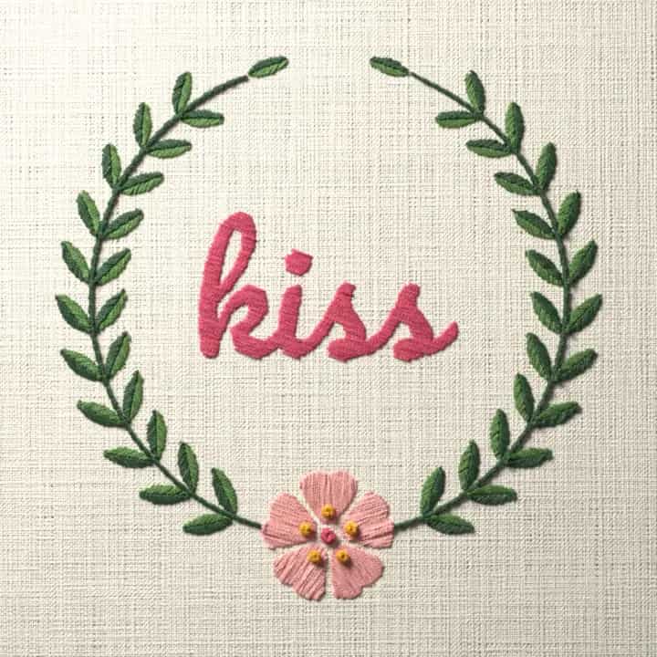 Kiss in script: preview of the stitched design