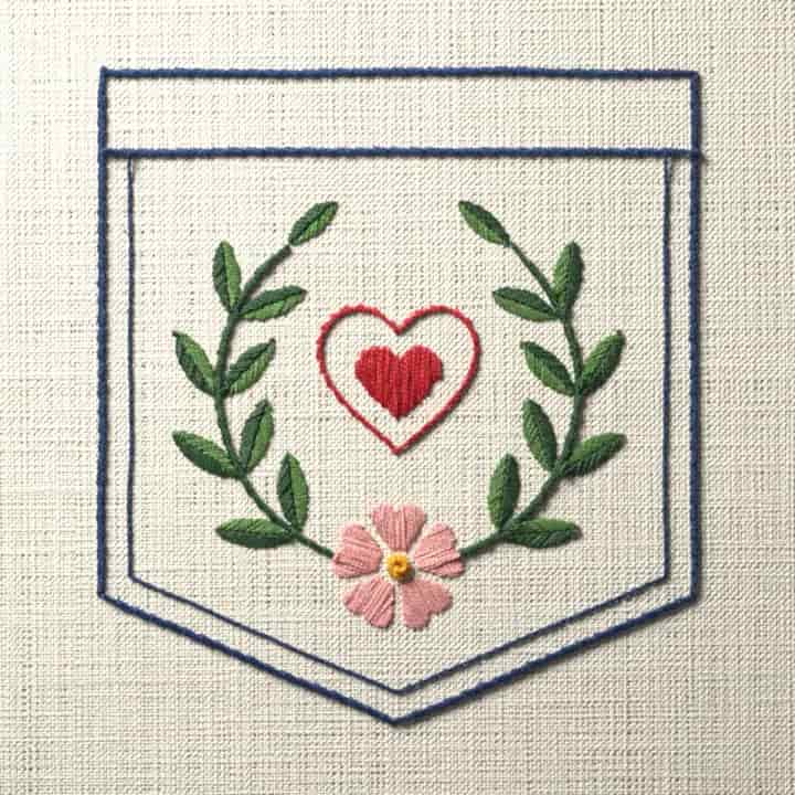 Pocket with laurel and heart: preview of the stitched design