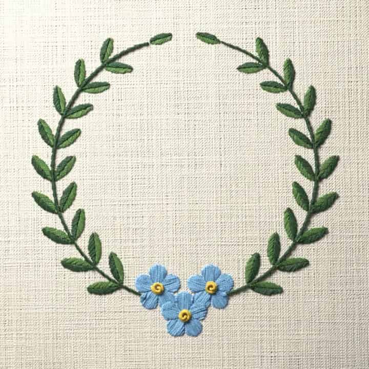 Forget-me-not laurel wreath: preview of the stitched design