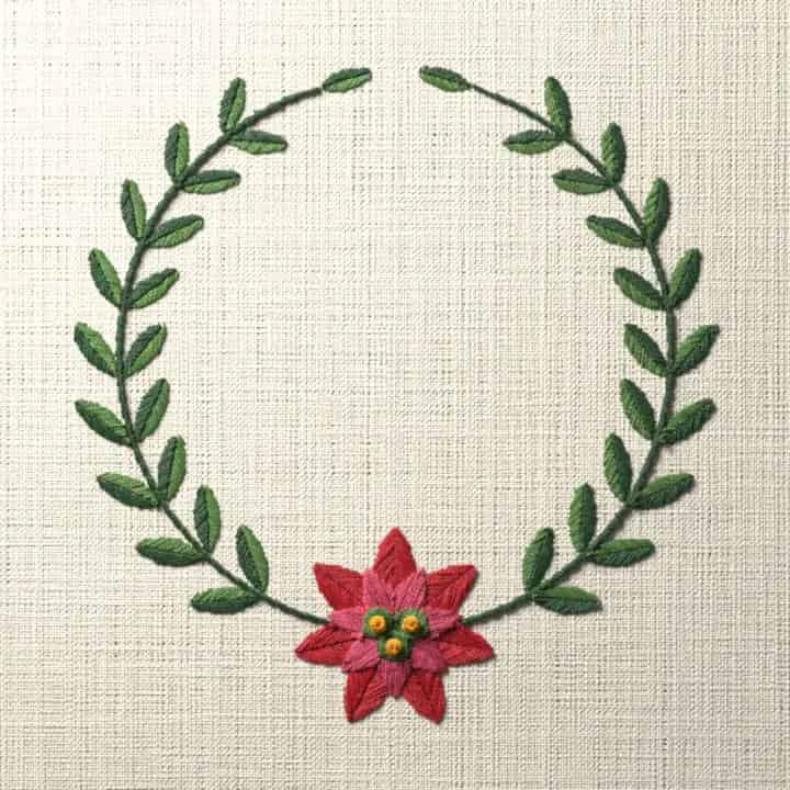Poinsettia and laurel wreath: preview of the stitched design