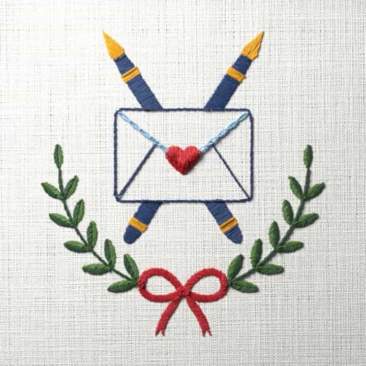 Envelope with crossed pens and laurel: preview of the stitched design