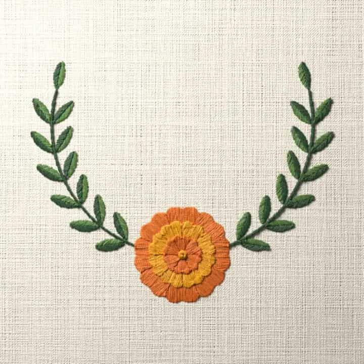 Marigold crescent spray: preview of the stitched design
