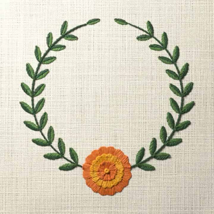 Marigold laurel wreath: preview of the stitched design