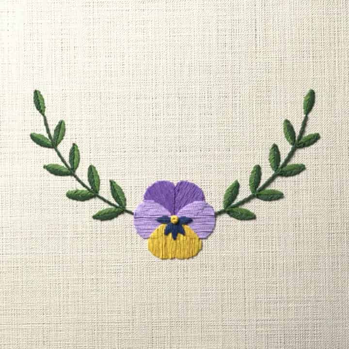 Pansy crescent spray: preview of the stitched design