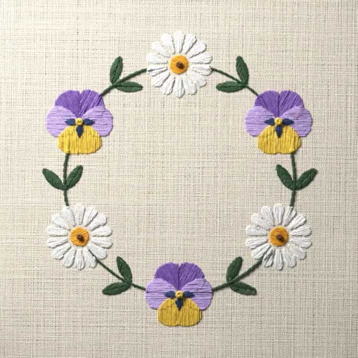 Pansy and daisy wreath: preview of the stitched design