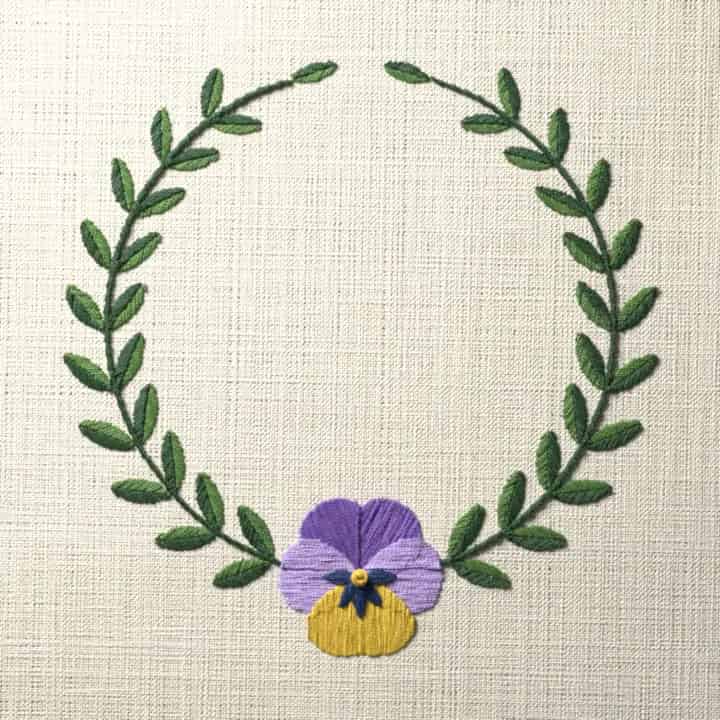 Pansy laurel wreath: preview of the stitched design