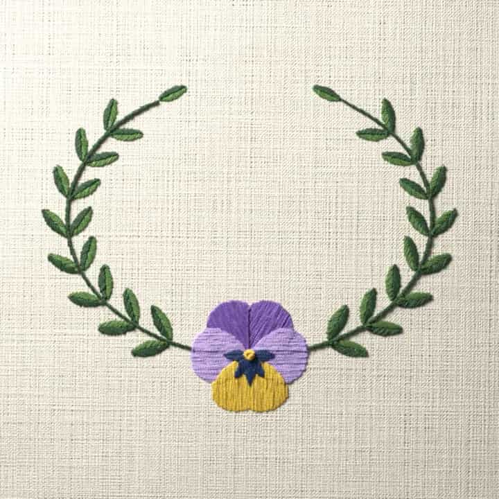 Pansy oval frame: preview of the stitched design