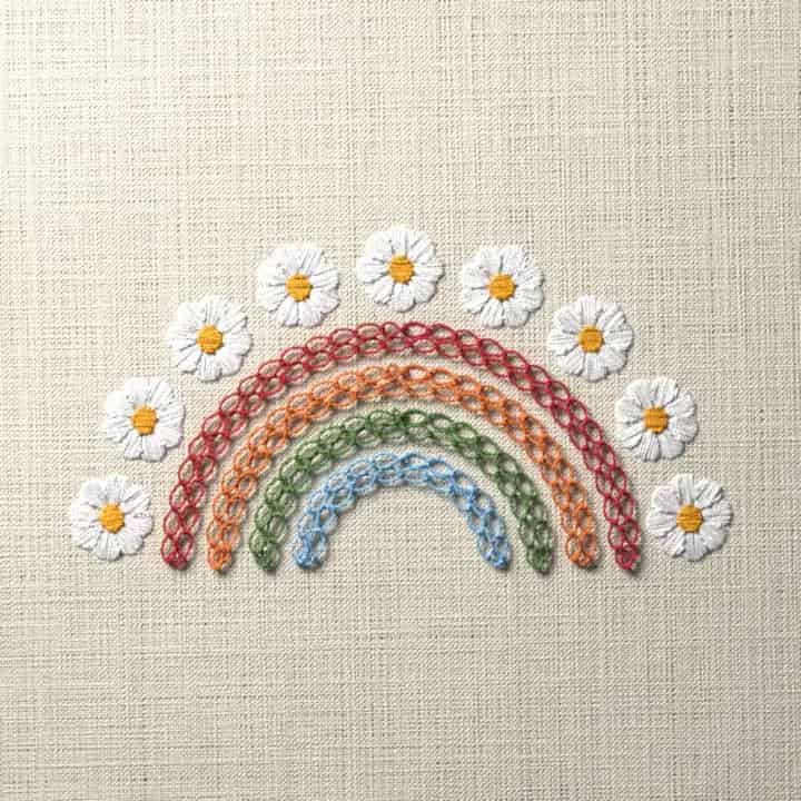 Rainbow with daisies: preview of the stitched design