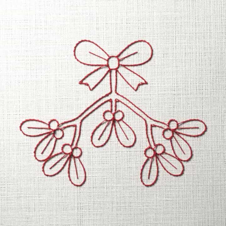 Redwork mistletoe under a bow: preview of the stitched design