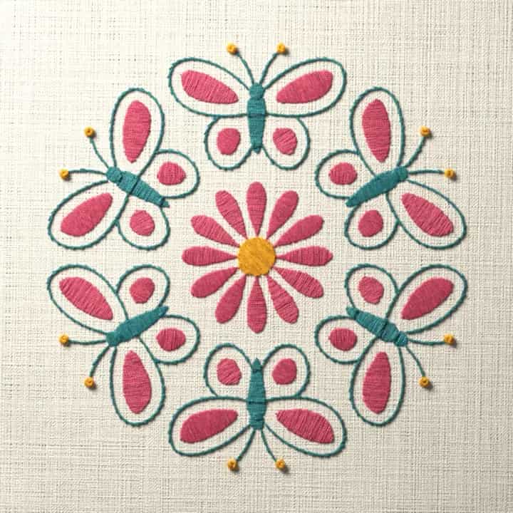 Six butterflies around a daisy: preview of the stitched design