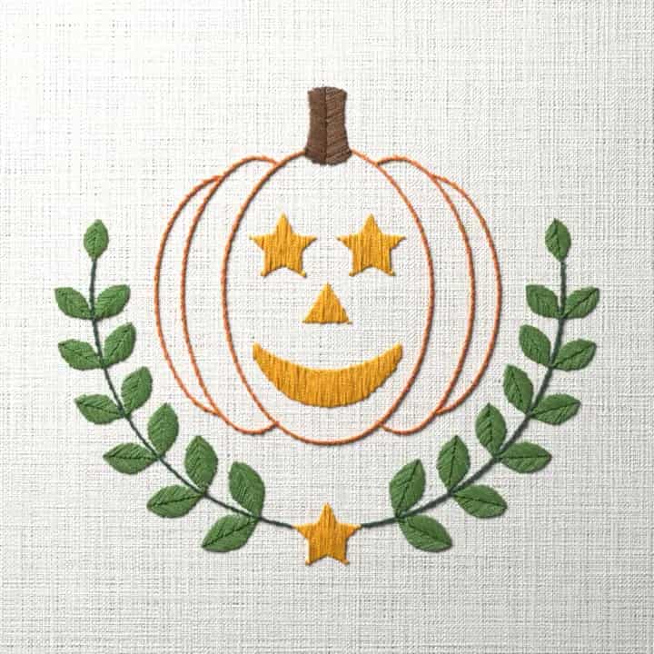 Star-eyed jack-o'-lantern in laurel: preview of the stitched design
