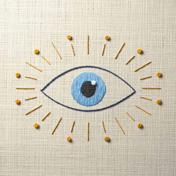 Eye with sun rays: preview of the stitched design