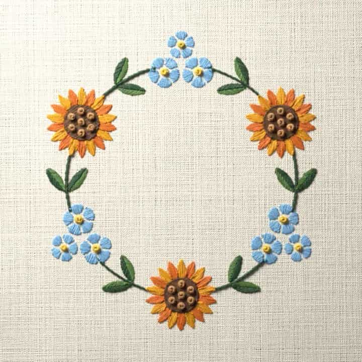 Sunflower and forget-me-not wreath: preview of the stitched design