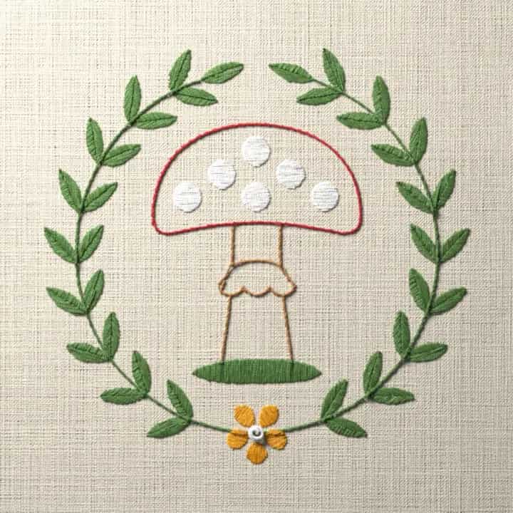 Toadstool in a leaf wreath: preview of the stitched design