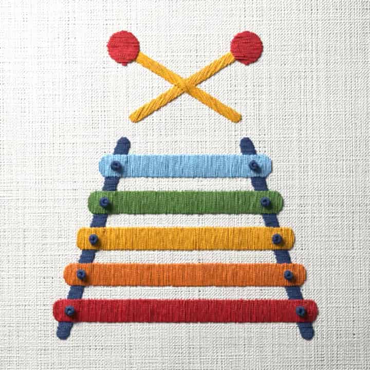 Toy xylophone with crossed mallets: preview of the stitched design
