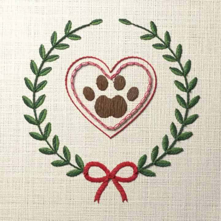 Paw print heart in a wreath: preview of the stitched design